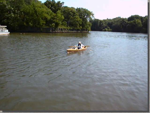 Johncanoe in water with builder aboard
